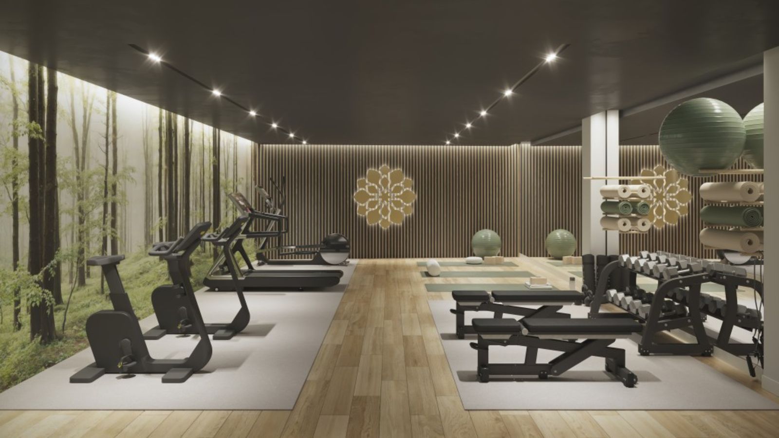 Salle de sport moderne avec équipements de fitness, poids et espace yoga.